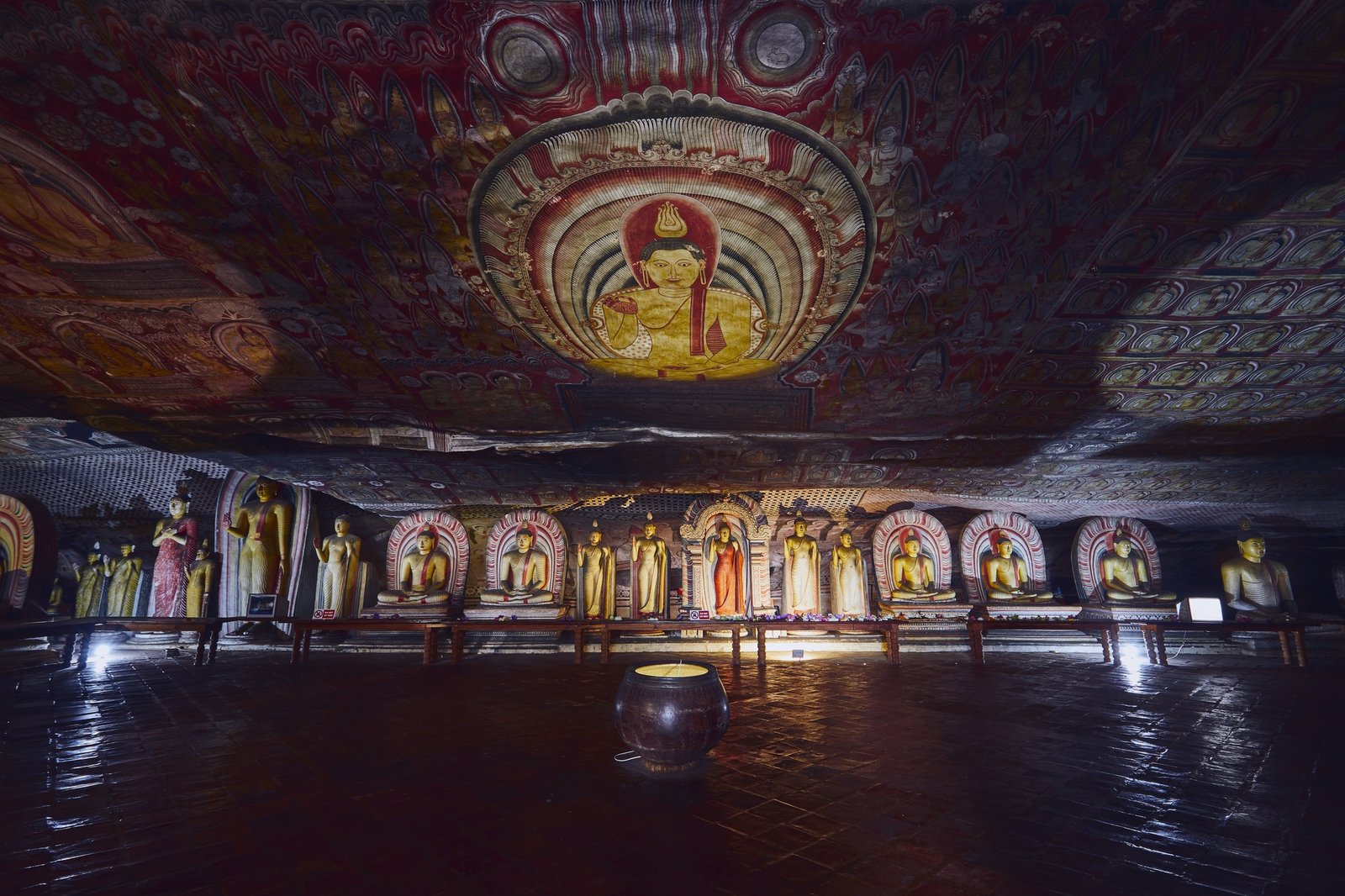 statues-and-paintings-inside-of-largest-and-best-preserved-cave-temple-complex-in-sri-lanka