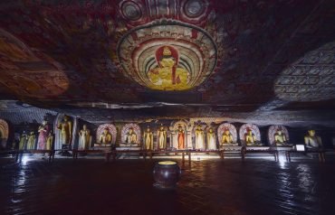 statues-and-paintings-inside-of-largest-and-best-preserved-cave-temple-complex-in-sri-lanka