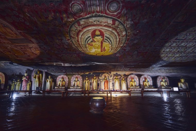 statues-and-paintings-inside-of-largest-and-best-preserved-cave-temple-complex-in-sri-lanka